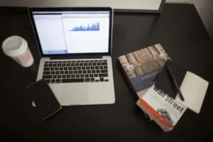 Table With Coffee, Book, Notebook, Laptop and Smart Phone