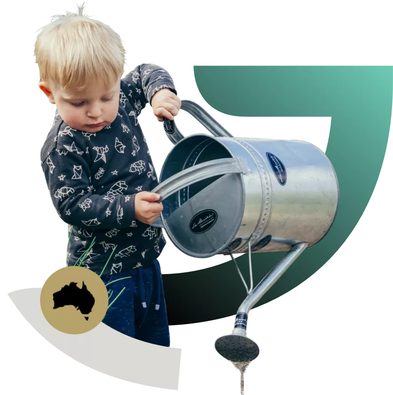Little Boy Pouring Water From Watering Can
