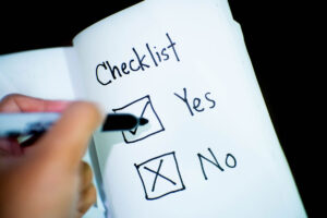 A person making on a checklist.