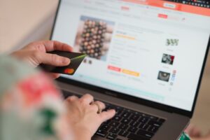 Man with Credit Card Browsing On An Online Shop