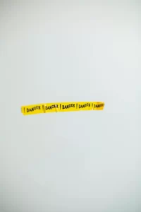 Word danger written in yellow strips